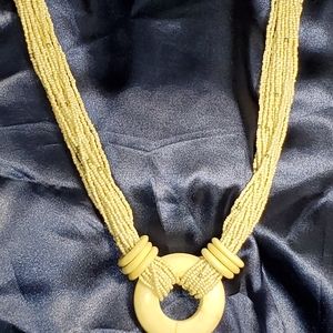 White beaded multi strand necklace